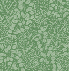 The Elin Berry Botanical Wallpaper by York Wallcoverings features a detailed white botanical pattern of leaves, branches, and berries densely arranged on a green background. This design creates a richly textured, natural look reminiscent of vintage botanical prints.