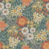 Discover the Karina Wildflower Garden Wallpaper by York Wallcoverings, featuring a seamless pattern of colorful, hand-drawn red, orange, yellow, and white blooms with green leaves arranged closely together on a dark background.