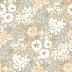 Karina Wildflower Garden Wallpaper by York Wallcoverings features a seamless pattern of hand-drawn flowers and leaves in soft pastel shades of beige, cream, yellow, and pale green, creating a delicate, vintage-inspired floral design.