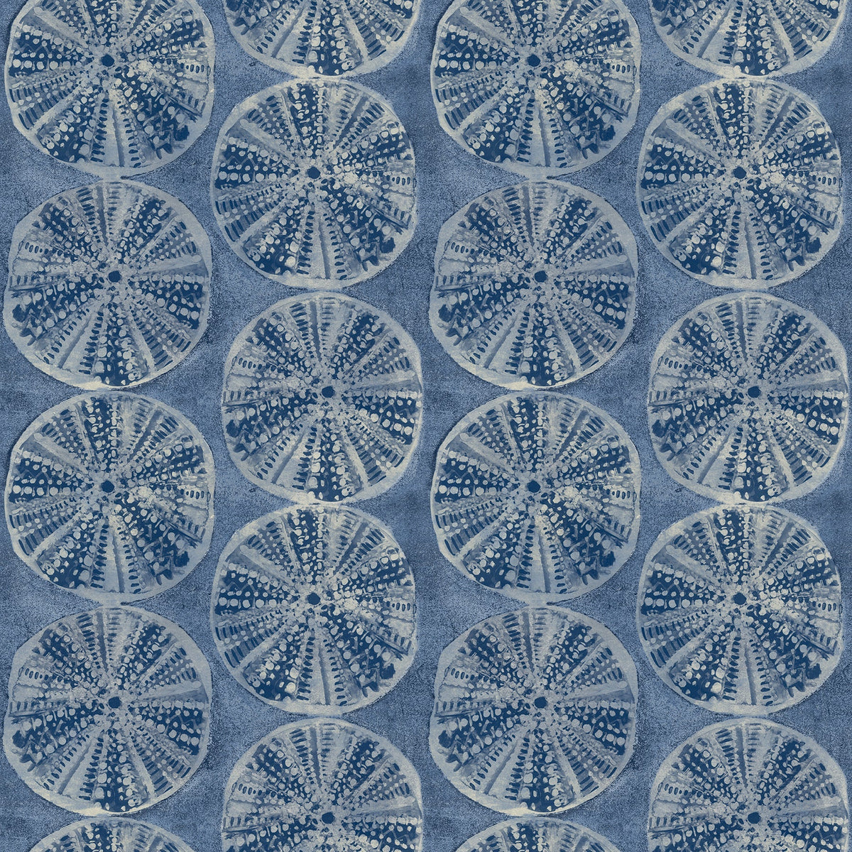 Chesapeake Sea Biscuit Sand Dollar Wallpaper by York Wallcoverings features a symmetrical, repeating pattern of circular sand dollar-like shapes in shades of blue and white, set against a textured blue background.