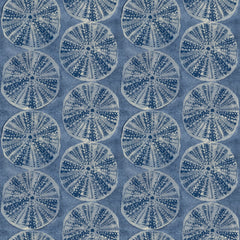 Chesapeake Sea Biscuit Sand Dollar Wallpaper by York Wallcoverings features a symmetrical, repeating pattern of circular sand dollar-like shapes in shades of blue and white, set against a textured blue background.