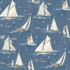 The Chesapeake Leeward Sailboat Wallpaper by York Wallcoverings features a repeating pattern of sailboats with white sails and red flags drifting on blue water, accompanied by seagulls and small lighthouses.