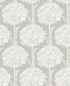 The Zaria Topiary Wallpaper by York Wallcoverings showcases a symmetrical, vintage-inspired design with repeating white, intricate tree-like motifs—featuring leaves and flowers—set against a light beige background.