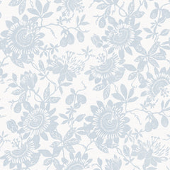 Helen Floral Trail Wallpaper by York Wallcoverings features a pale blue floral pattern of passionflowers, leaves, and small fruits on a white background, creating a delicate and vintage-inspired wallpaper design.