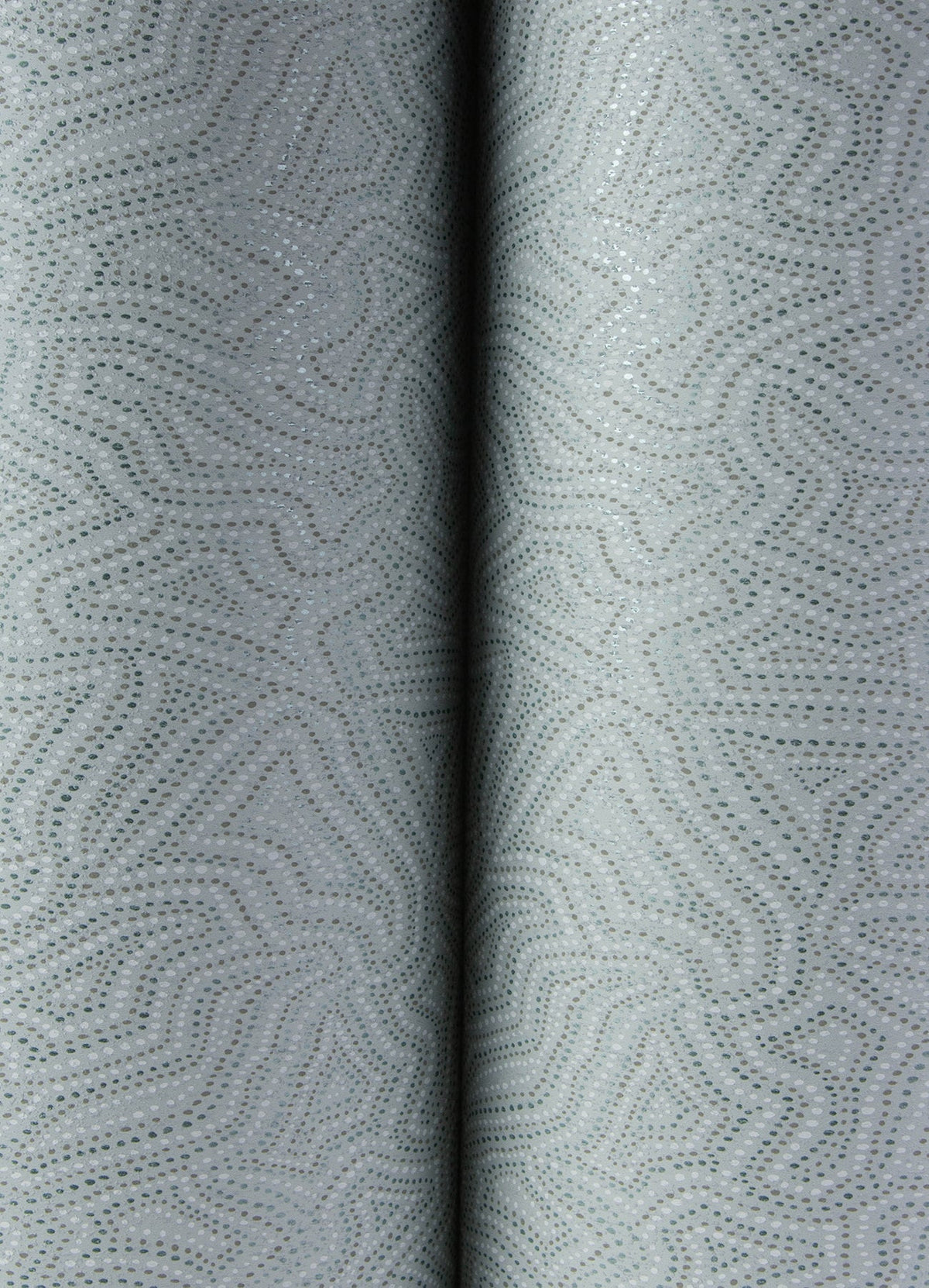 Close-up of Hollenback Dotted Abstract Wallpaper by York Wallcoverings, showcasing a light gray surface with a subtle, abstract dotted pattern and gentle folds in the center that create a textured, softly curved appearance.
