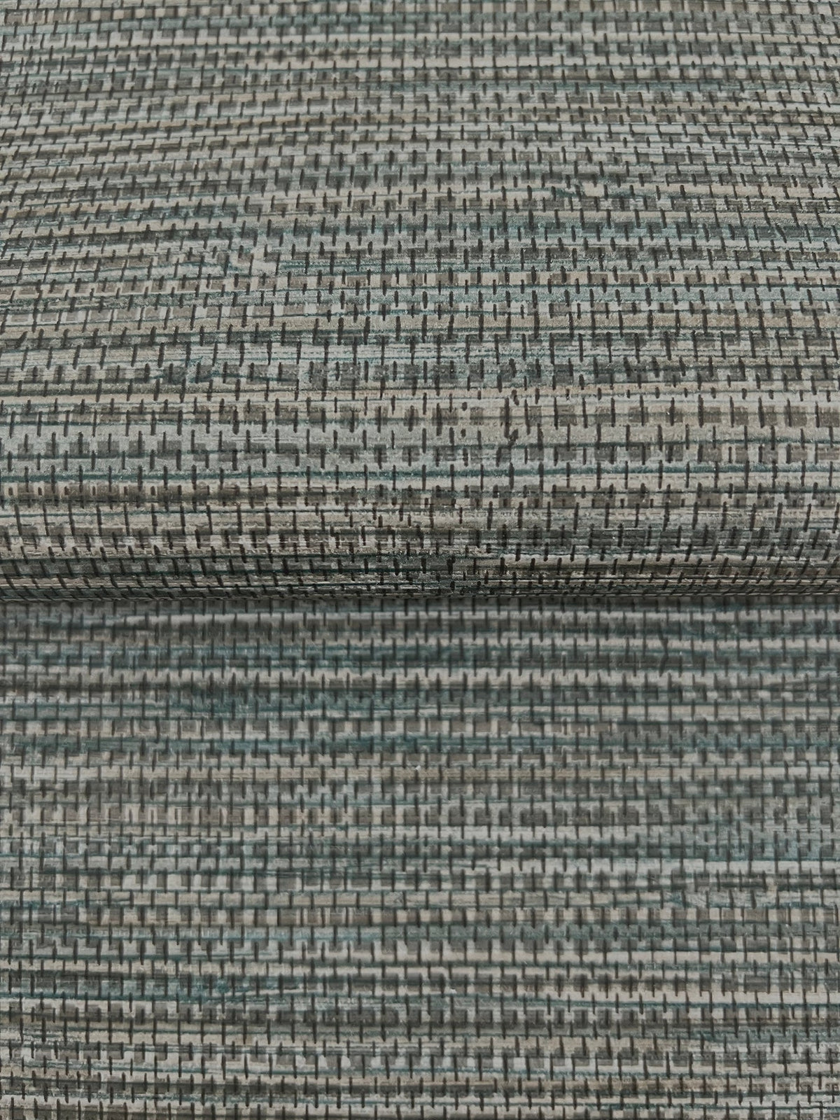 Winn Faux Grasscloth Wallpaper featuring a textured, woven pattern in shades of grey, blue, and black.