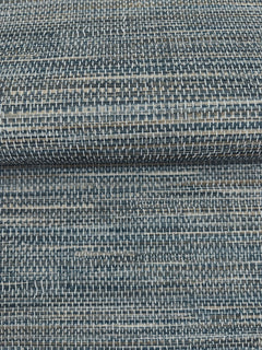 A close-up of dark blue and grey Winn Faux Grasscloth Wallpaper by York Wallcoverings, featuring a woven, horizontal texture.
