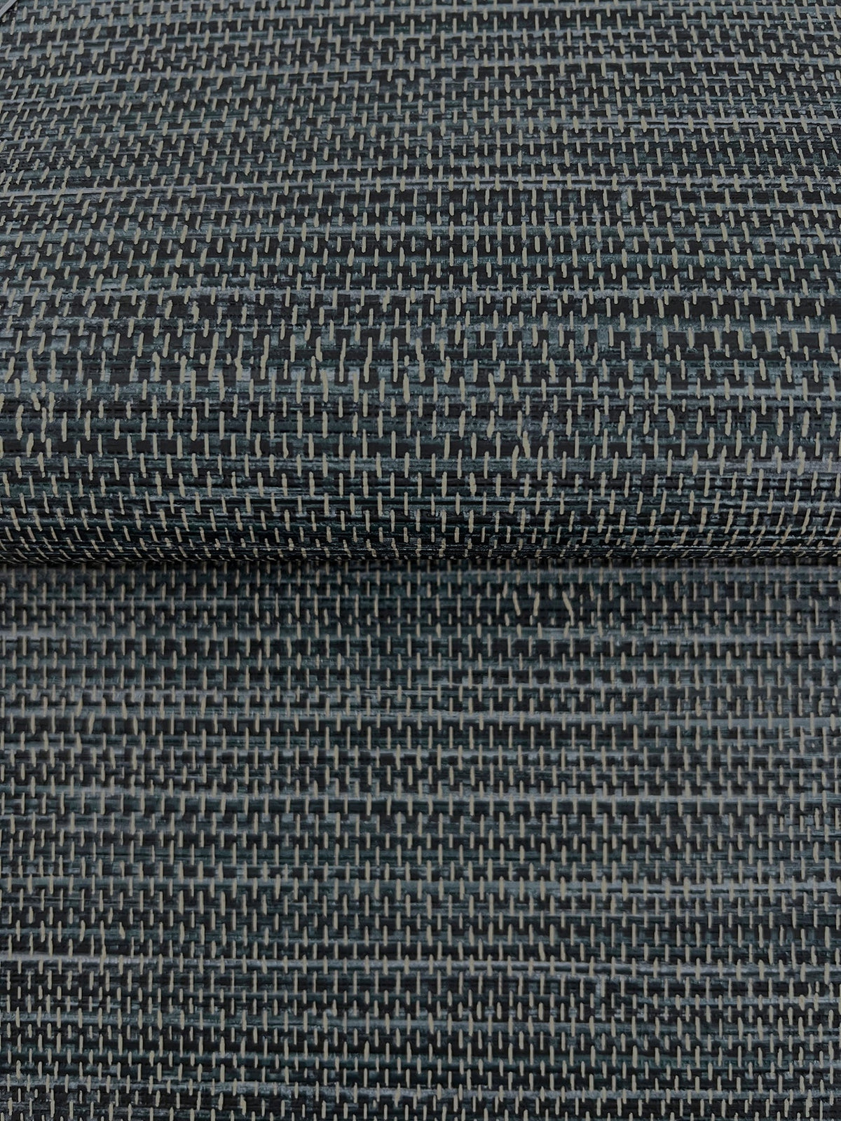 Winn Faux Grasscloth Wallpaper in dark blue, featuring a woven, grid-like texture and light gray vertical stitching.