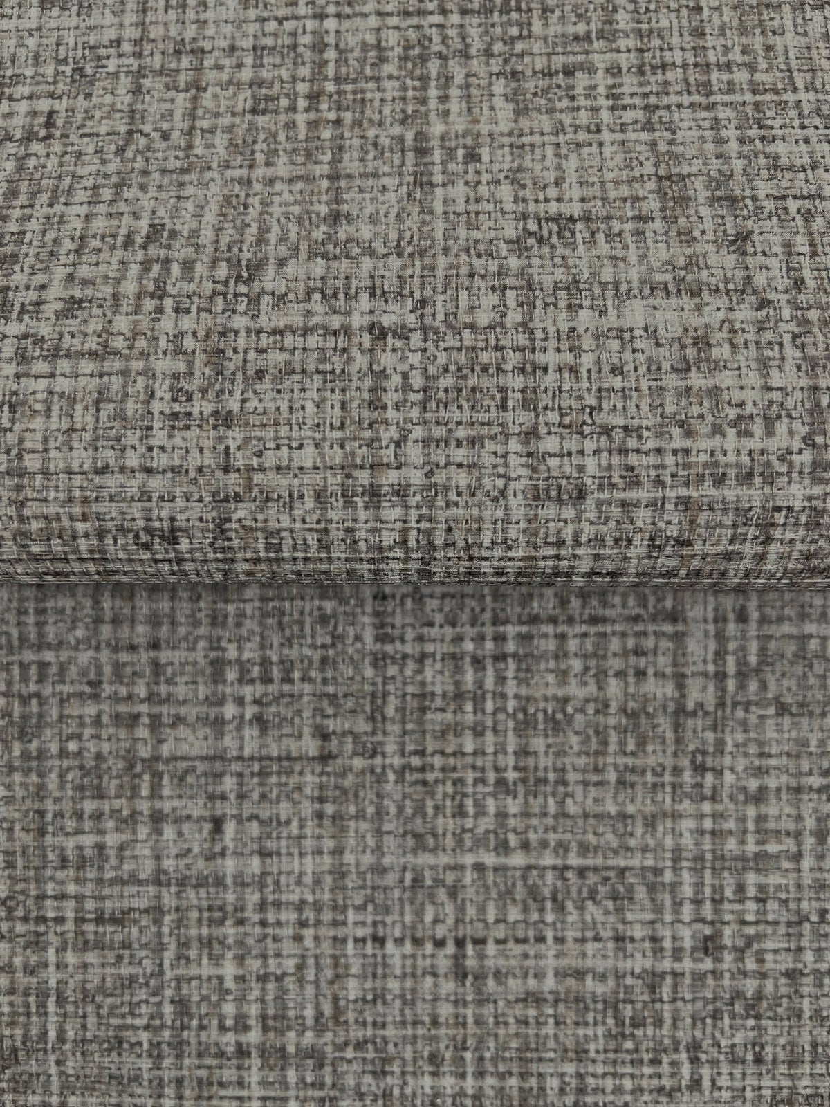 Close-up of gray Clarkson Woven Wallpaper featuring a textured, woven crosshatch pattern.