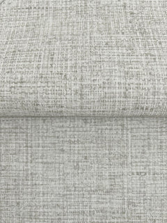 A folded piece of Clarkson Woven Wallpaper featuring a light gray, textured, cross-hatched pattern.