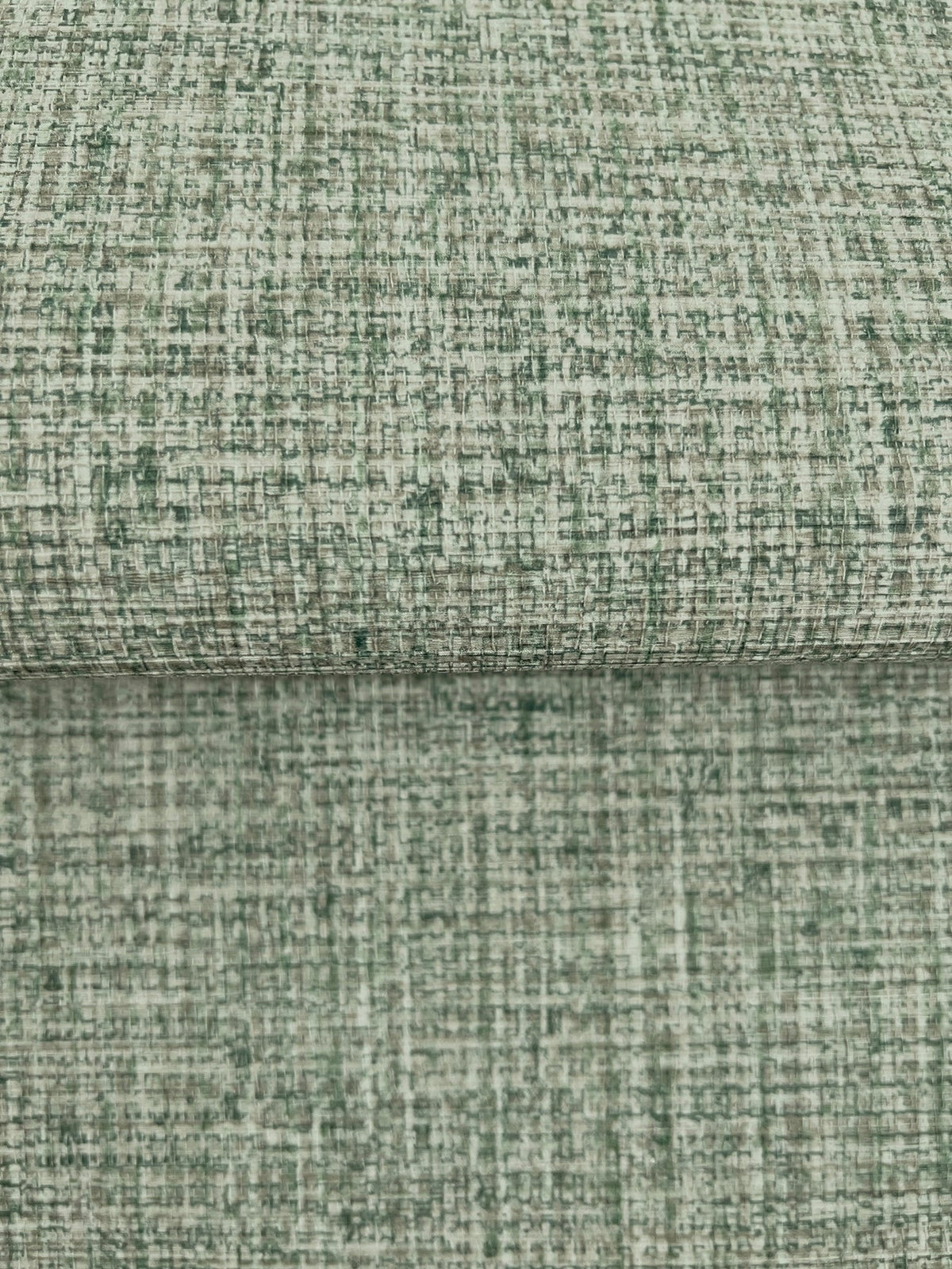 Clarkson Woven Wallpaper with a green and off-white cross-hatched textured pattern.