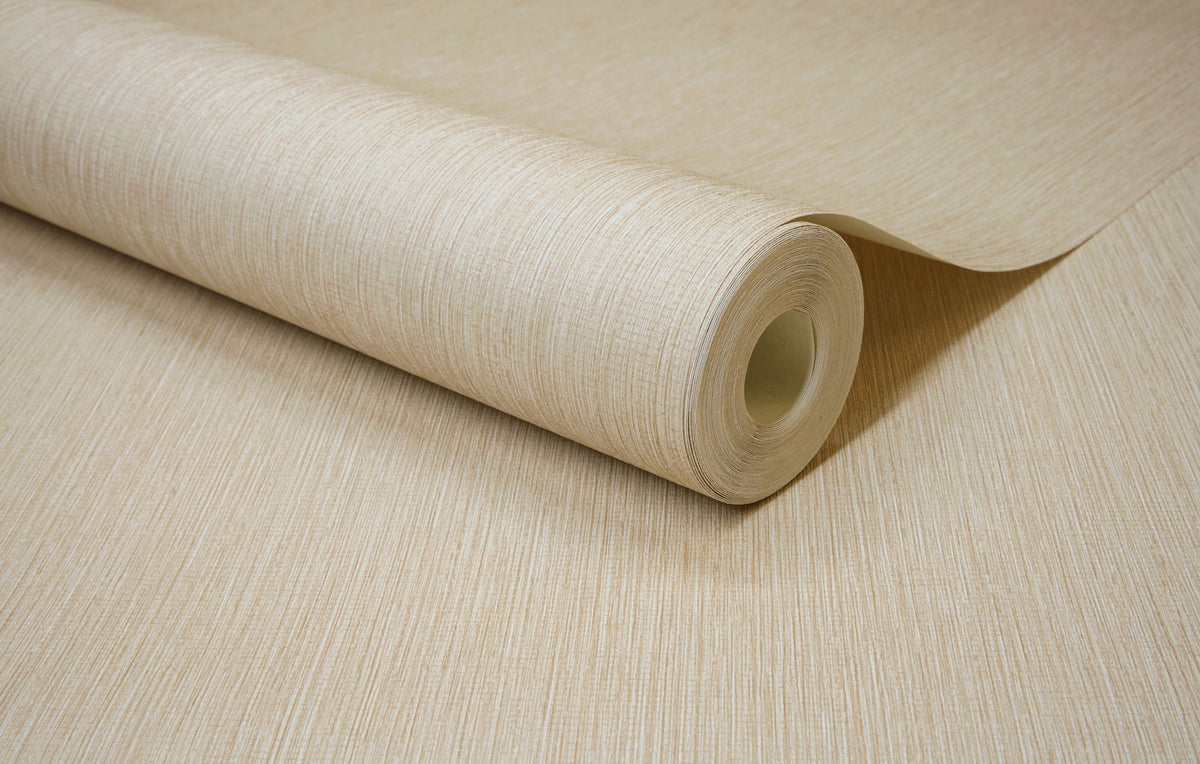 A close-up of the York Wallcoverings Chesapeake Elijah Texture Wallpaper roll, partially unrolled on a flat surface, highlights its subtle vertical line pattern and elegant beige texture.