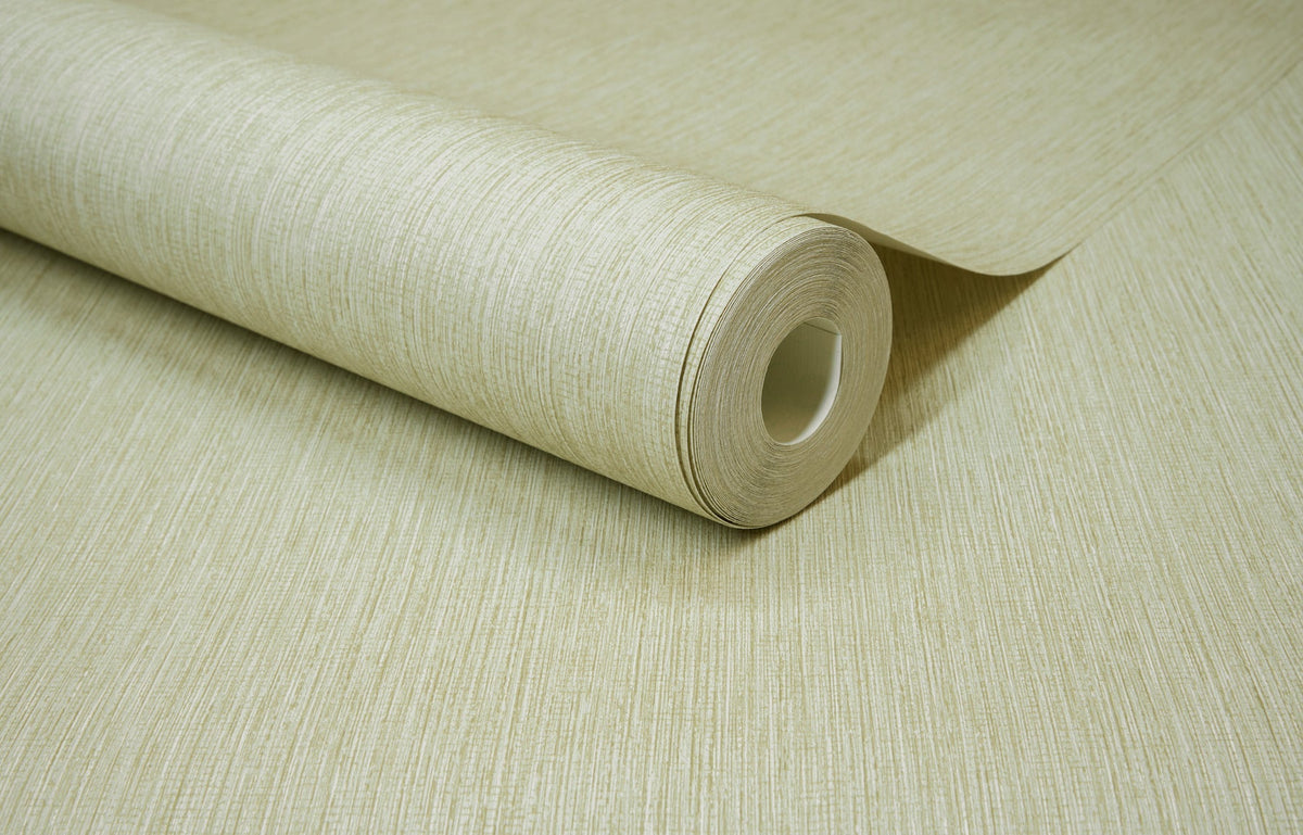 A close-up of a roll of York Wallcoverings Chesapeake Elijah Texture Wallpaper in beige, partially unrolled on a matching flat surface.