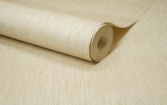 A close-up of the Chesapeake Elijah Texture Wallpaper by York Wallcoverings, in beige, partially unrolled on a matching surface.