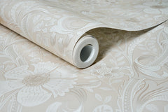 A partially unrolled roll of Chesapeake Liora Floral Trail Wallpaper by York Wallcoverings, featuring a beige background with a white floral pattern displayed on a matching surface.