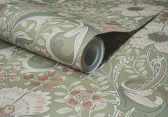 A close-up of the York Wallcoverings Chesapeake Liora Floral Trail Wallpaper, featuring a vintage floral design in green, beige, and muted red tones, partially unrolled to reveal its detailed botanical pattern.
