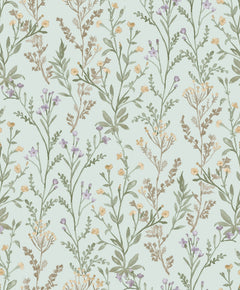 The Chesapeake Laverne Wildflowers Wallpaper by York Wallcoverings features a seamless pattern of delicate wildflowers and leafy stems in muted green, yellow, and lavender tones on a light blue background, creating a soft, vintage, and natural ambiance.