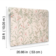 The Chesapeake Laverne Wildflowers Wallpaper by York Wallcoverings features a pink background adorned with green leaves and small pink flowers. Each roll measures 33 ft (10.05 m) long and 20.86 in (53 cm) wide.