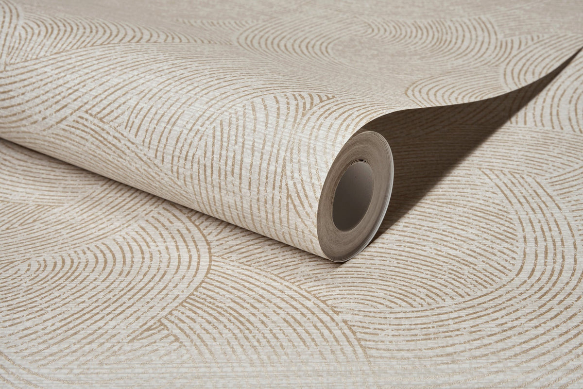 A close-up of a rolled sheet of Chesapeake Harrison Swirling Geometric Wallpaper by York Wallcoverings, featuring a beige and off-white wavy geometric pattern that highlights the textured surface and the open end of the roll.