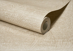 A partially unrolled roll of Chesapeake Harrison Swirling Geometric Wallpaper by York Wallcoverings in beige, featuring a textured pattern of curved, intersecting lines.