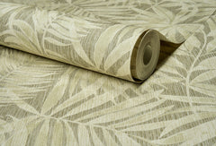 A partially unrolled roll of York Wallcoverings Chesapeake Sonny Fronds Wallpaper in beige, featuring a subtle palm leaf pattern with light, natural tones and a textured finish, displayed on a matching surface.