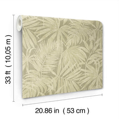 The Chesapeake Sonny Fronds Wallpaper by York Wallcoverings is a roll of beige wallpaper featuring a subtle tropical leaf pattern, measuring 33 ft (10.05 m) in length and 20.86 in (53 cm) in width.