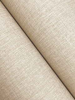 Close-up of Chesapeake Sonia Faux Linen Wallpaper by York Wallcoverings, featuring a light beige textured finish with a subtle crisscross pattern, shown at an angle with a diagonal seam running across the image.