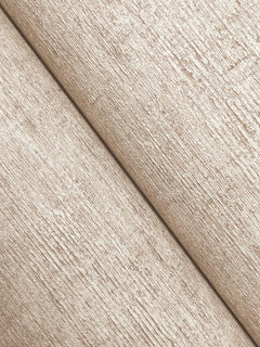 Close-up of Chesapeake Tansy Distressed Wallpaper by York Wallcoverings, featuring two beige, textured sections with a diagonal seam running from the bottom left to the top right, highlighting its rough, woven-like pattern and subtle shadow along the seam.
