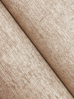 Close-up of two beige Chesapeake Tansy Distressed Wallpaper surfaces from York Wallcoverings meeting at an angle, with a visible seam running diagonally across the image. The wallpaper features a rough, fibrous texture.