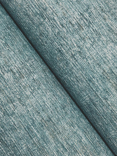 Close-up of two Chesapeake Tansy Distressed Wallpaper surfaces by York Wallcoverings in light blue, placed diagonally to showcase their textured, slightly shiny and worn fabric-like appearance.