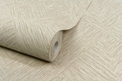 A roll of Chesapeake Hollis Textured Diamond Wallpaper by York Wallcoverings, featuring a beige geometric texture, is partially unrolled on a matching surface.