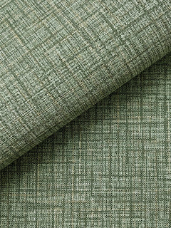 Close-up of Beau Faux Fabric Wallpaper by York Wallcoverings in light green, featuring a subtle grid pattern and two overlapping layers. The wallpaper’s textured weave and fine intersecting lines create a geometric, modern appearance.
