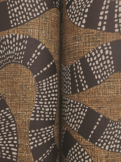 Close-up of York Wallcoverings’ Ophidia Wallpaper, featuring a modern abstract design with brown, black, and white wavy shapes and dotted lines reminiscent of snake-like or organic patterns.