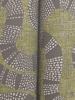 Ophidia Wallpaper by York Wallcoverings features abstract green and gray curved shapes with white dotted lines over textured backgrounds, designed to flow seamlessly across two adjacent panels for a striking central vertical seam.