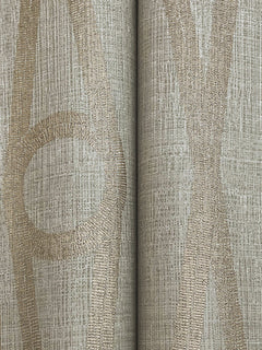 Henlein Wallpaper by York Wallcoverings features a beige and tan color palette with textured, abstract vertical lines and circular patterns. The symmetrical design includes a central seam where two panels of the wallpaper meet.