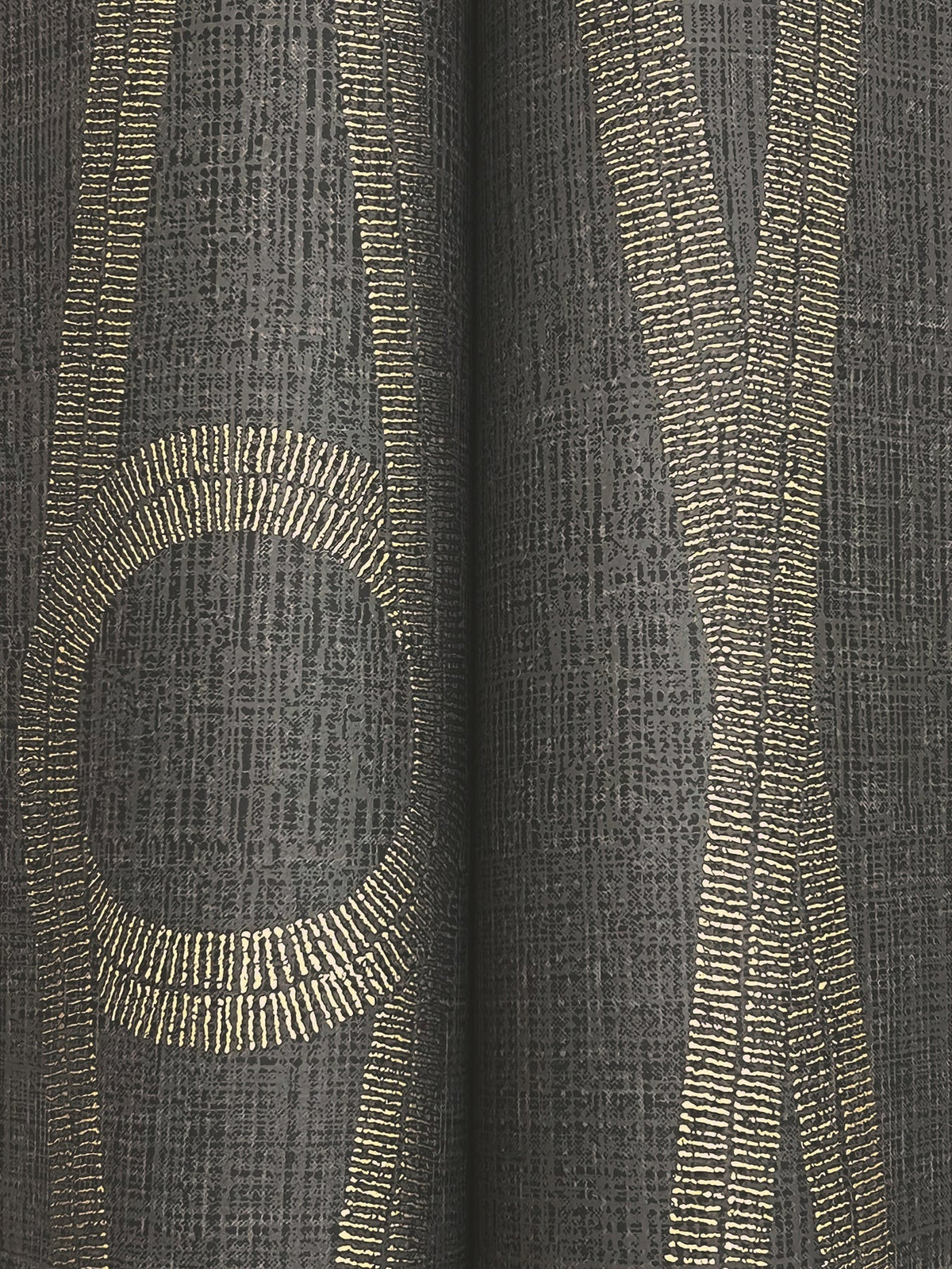 Henlein Wallpaper by York Wallcoverings features a textured dark gray surface adorned with abstract vertical and curved gold lines—some forming intersecting and oval shapes. The metallic, dotted appearance of the lines creates a striking contrast against the matte background.