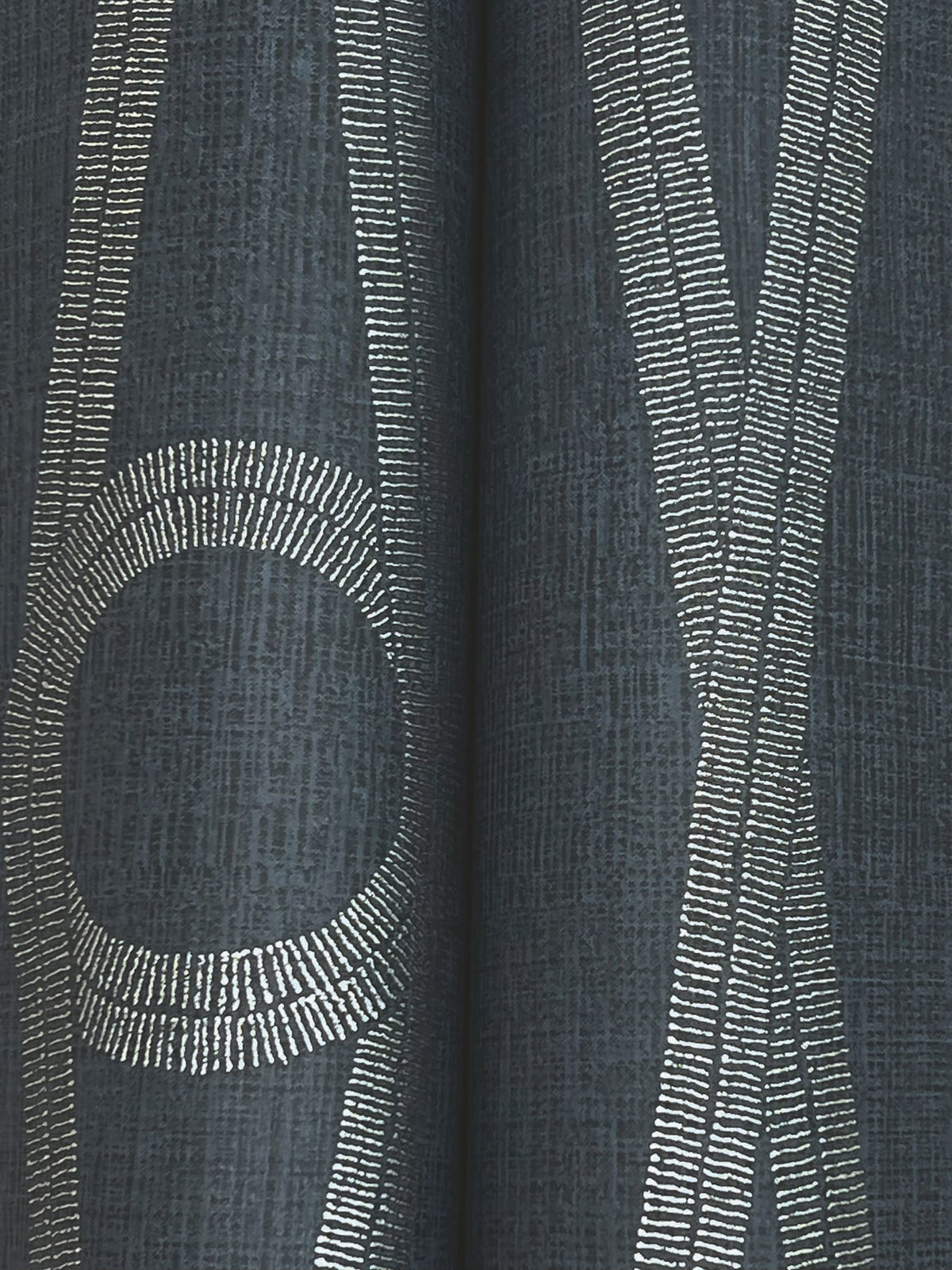 Henlein Wallpaper by York Wallcoverings features a dark textured surface accented with three prominent silver metallic lines running vertically and a single curved silver line forming a partial oval, creating an abstract geometric pattern.