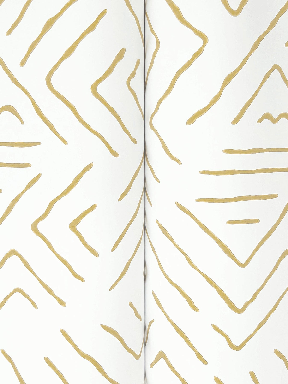 Sirih Wallpaper by York Wallcoverings features a white background with abstract, hand-drawn gold lines forming geometric shapes. The design creates a continuous pattern reminiscent of the center crease in an open book or notebook, flowing seamlessly across the surface.