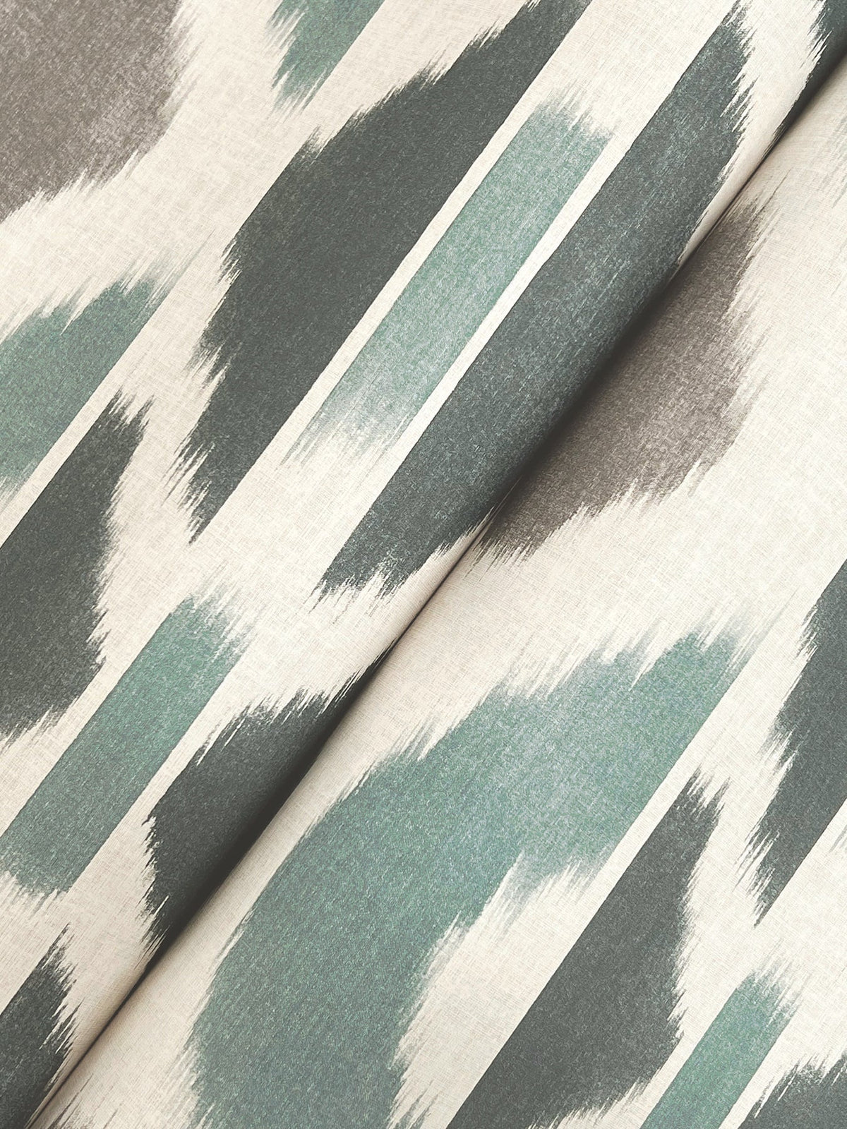 Patan Wallpaper by York Wallcoverings features a beige background adorned with diagonal abstract brushstroke patterns in green, gray, and teal tones, creating a modern artistic texture.
