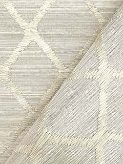 A close-up of Tonga Wallpaper by York Wallcoverings in light beige, featuring a raised geometric diamond pattern, with one section slightly folded over to highlight the textured design from both flat and angled perspectives.