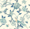 Fanciful Wallpaper by York Wallcoverings features illustrated birds, flowers, branches, and butterflies in soft blue, green, and cream hues on a light background, creating a vintage, nature-inspired look.