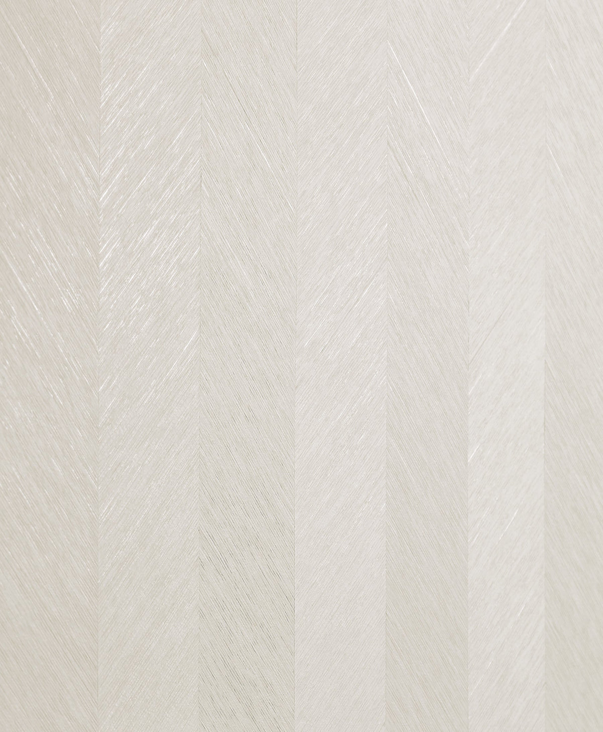 Close-up of York Wallcoverings’ Chevron Wallpaper, featuring a subtle, repeating herringbone pattern in light beige tones for a soft and elegant appearance.