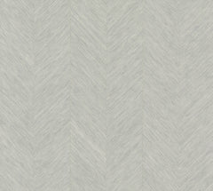 Chevron Wallpaper by York Wallcoverings features a light gray hue with a refined herringbone pattern of slim diagonal lines forming a chevron effect, lending the surface a textured and contemporary feel.
