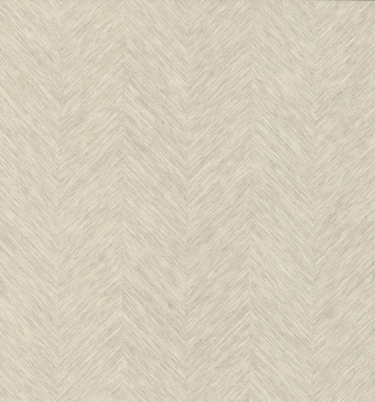 Chevron Wallpaper by York Wallcoverings features a beige textured surface accented with a subtle, vertical herringbone pattern. Fine angled lines create a chevron effect reminiscent of woven fabric, resulting in a light and neutral appearance suitable for various interiors.