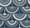 Feather & Fringe Wallpaper by York Wallcoverings features a seamless pattern of stylized peacocks with layered, fan-shaped tails in shades of blue, gray, and white on a dark blue background. The design repeats across the surface.