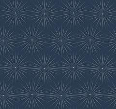 Starlight Wallpaper by York Wallcoverings features a geometric, symmetrical design with a repeating dark blue pattern accented by white dotted starbursts radiating from circular centers.