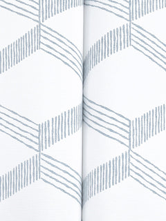 The Palisades Paperweave Wallpaper by York Wallcoverings features a white background adorned with a repeating pattern of blue zigzag diagonal lines and a vertical seam running down the center.