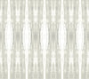 The Escalante Wallpaper by York Wallcoverings features a symmetrical abstract pattern with vertical, elongated shapes in light gray and white tones, reminiscent of mirrored watercolor brush strokes. This design creates a soft, textured, and repeating geometric effect.