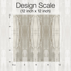 A square 12x12 inch fabric swatch of York Wallcoverings’ Escalante Wallpaper, featuring a muted, abstract beige and gray pattern, is displayed on a grid with inch measurements along the top and left edges. Text above reads Design Scale (12 inch x 12 inch).