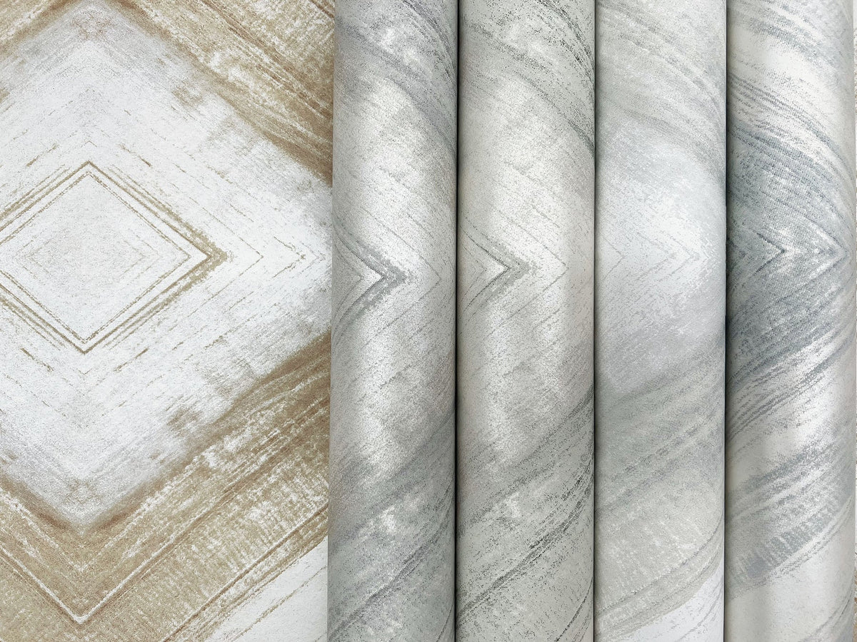 Four rolls of Ballad Wallpaper featuring a gray and tan chevron pattern with a textured, metallic appearance.